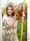 staff_page/girl-holding-chicken-brown-35201622.jpg