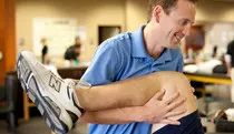 PT/Images/man holding leg.jpg