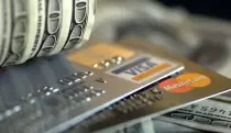Money_on_Top_of_Credit_Cards_Wide.jpg
